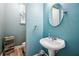 Charming powder room with wood-style flooring and modern fixtures, enhancing the home's appeal at 2755 Evan Manor Ln, Cumming, GA 30041