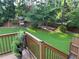 View from deck of the backyard, showcasing lush green grass and a play structure at 3641 Bramblewood Way, Marietta, GA 30062