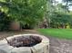 Backyard oasis featuring a brick fire pit perfect for outdoor entertaining and relaxation at 3641 Bramblewood Way, Marietta, GA 30062