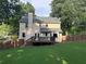 Spacious backyard with manicured lawn, a deck, and privacy fence, perfect for outdoor living at 3641 Bramblewood Way, Marietta, GA 30062