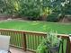Manicured backyard featuring lush green lawn and inviting deck, perfect for outdoor relaxation at 3641 Bramblewood Way, Marietta, GA 30062