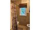 Well-lit renovated bathroom with patterned shower curtain and stylish woven blind at 3641 Bramblewood Way, Marietta, GA 30062
