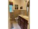 Comfortable renovated bathroom featuring granite countertop, wood accents, and tiled flooring at 3641 Bramblewood Way, Marietta, GA 30062