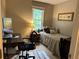 Cozy bedroom featuring a twin bed, desk, and a bright window for natural light at 3641 Bramblewood Way, Marietta, GA 30062