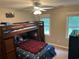 bedroom with bunk beds, ceiling fan and a window to provide natural light at 3641 Bramblewood Way, Marietta, GA 30062