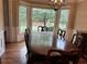 Elegant dining room featuring a bay window, chandelier, and hardwood floors at 3641 Bramblewood Way, Marietta, GA 30062