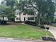 A view of the home from the street, showing the manicured lawn and mailbox along the driveway at 3641 Bramblewood Way, Marietta, GA 30062