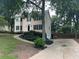 A view of the home from the side showing a long driveway and the two-car garage at 3641 Bramblewood Way, Marietta, GA 30062