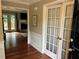 Spacious living room with hardwood floors, fireplace, french doors, and access to the outdoor deck at 3641 Bramblewood Way, Marietta, GA 30062