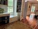 Bright living space featuring a window seat, built-in bookcase and hardwood floors at 3641 Bramblewood Way, Marietta, GA 30062