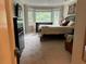 Carpeted main bedroom with bay window, black dresser, and stylish comfortable furnishings at 3641 Bramblewood Way, Marietta, GA 30062