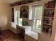 Home office with built-in shelves, drawers, bench seating, and a desk with natural light at 3641 Bramblewood Way, Marietta, GA 30062