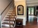 Elegant staircase with wooden banister and painted risers, leading to the upper level of the home at 3641 Bramblewood Way, Marietta, GA 30062