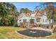 Back exterior featuring deck with built in seating, and fire pit at 4141 Willow Ridge Rd, Douglasville, GA 30135
