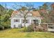 Charming back exterior of home featuring a deck, manicured lawn, and tasteful landscaping at 4141 Willow Ridge Rd, Douglasville, GA 30135