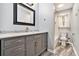 Charming bathroom features a shower-tub combo with marble tile, and a modern vanity with marble countertop at 4141 Willow Ridge Rd, Douglasville, GA 30135