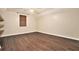 This bright bedroom features hardwood floors, a ceiling fan, and a window with natural light at 4141 Willow Ridge Rd, Douglasville, GA 30135