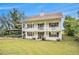 Charming two-story home featuring a welcoming porch on both levels and a spacious front yard with convenient carport at 4141 Willow Ridge Rd, Douglasville, GA 30135