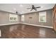 Spacious living room with hardwood floors, recessed lighting, fan, and three windows with natural light at 4141 Willow Ridge Rd, Douglasville, GA 30135