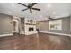 Spacious living room featuring fireplace, hardwood floors, recessed lighting, fan, and natural light at 4141 Willow Ridge Rd, Douglasville, GA 30135
