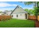 A well-manicured backyard featuring a wood fence and green grass at 623 Hamilton E Holmes Nw Dr, Atlanta, GA 30318