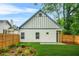 A backyard with a green lawn and wood privacy fence at 623 Hamilton E Holmes Nw Dr, Atlanta, GA 30318