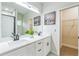 Modern bathroom with double sink vanity, tile floors, and neutral tones at 623 Hamilton E Holmes Nw Dr, Atlanta, GA 30318