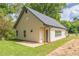 Charming home with light siding, dark gray roof, green grass and a simple landscape design at 623 Hamilton E Holmes Nw Dr, Atlanta, GA 30318