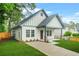 An inviting home exterior featuring a lush lawn, and a private driveway at 623 Hamilton E Holmes Nw Dr, Atlanta, GA 30318