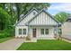 Charming exterior of a home featuring a manicured lawn and neutral paint scheme at 623 Hamilton E Holmes Nw Dr, Atlanta, GA 30318