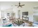 Open-concept living area with high ceilings, contemporary furnishings, and an adjacent dining and kitchen area at 623 Hamilton E Holmes Nw Dr, Atlanta, GA 30318
