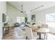 Open-concept living room connecting to a dining area, featuring modern lighting and ample natural light at 623 Hamilton E Holmes Nw Dr, Atlanta, GA 30318