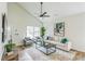 Inviting living space with high ceilings, modern decor, a comfortable sofa, and lots of light at 623 Hamilton E Holmes Nw Dr, Atlanta, GA 30318