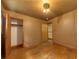 Bedroom features hardwood floors and two entry doors at 629 Hickory Se Trl, Mableton, GA 30126