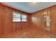 Empty wood paneled bedroom featuring hardwood floors at 629 Hickory Se Trl, Mableton, GA 30126