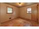 Empty bedroom with hardwood floors and two windows at 629 Hickory Se Trl, Mableton, GA 30126