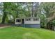 Charming home with a well-maintained lawn and mature trees at 629 Hickory Se Trl, Mableton, GA 30126