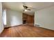 Inviting living room featuring hardwood floors and a brick fireplace at 629 Hickory Se Trl, Mableton, GA 30126