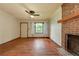 Hardwood floors and a brick fireplace create a warm atmosphere at 629 Hickory Se Trl, Mableton, GA 30126