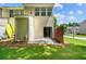 Backyard of the home featuring a small patio, grass, and exterior view at 1343 Penhurst Dr, Lawrenceville, GA 30043