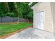 Exterior shot of the backyard with green grass and a fence at 1343 Penhurst Dr, Lawrenceville, GA 30043