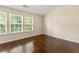 Bright bedroom with large windows, hardwood floors, and plenty of natural light at 1343 Penhurst Dr, Lawrenceville, GA 30043