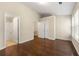 Spacious bedroom with hardwood floors, dual closets, and ensuite bathroom access at 1343 Penhurst Dr, Lawrenceville, GA 30043