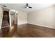 Bright living room boasting gleaming hardwood floors and a modern ceiling fan at 1343 Penhurst Dr, Lawrenceville, GA 30043