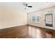 Bright living room with hardwood floors, ceiling fan, and natural light at 1343 Penhurst Dr, Lawrenceville, GA 30043