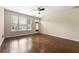 Spacious living room filled with natural light, featuring hardwood floors and a ceiling fan at 1343 Penhurst Dr, Lawrenceville, GA 30043