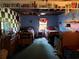 Basement bedroom with two twin beds, overhead lighting, and checkered decor accents at 135 Woodcrest Dr, Covington, GA 30016