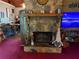 Stone fireplace in living area with decor at 135 Woodcrest Dr, Covington, GA 30016