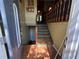 Inviting foyer with decorative steps leading to the upper level at 135 Woodcrest Dr, Covington, GA 30016