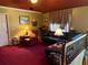 Warm living room with a comfy leather couch and cozy decor at 135 Woodcrest Dr, Covington, GA 30016